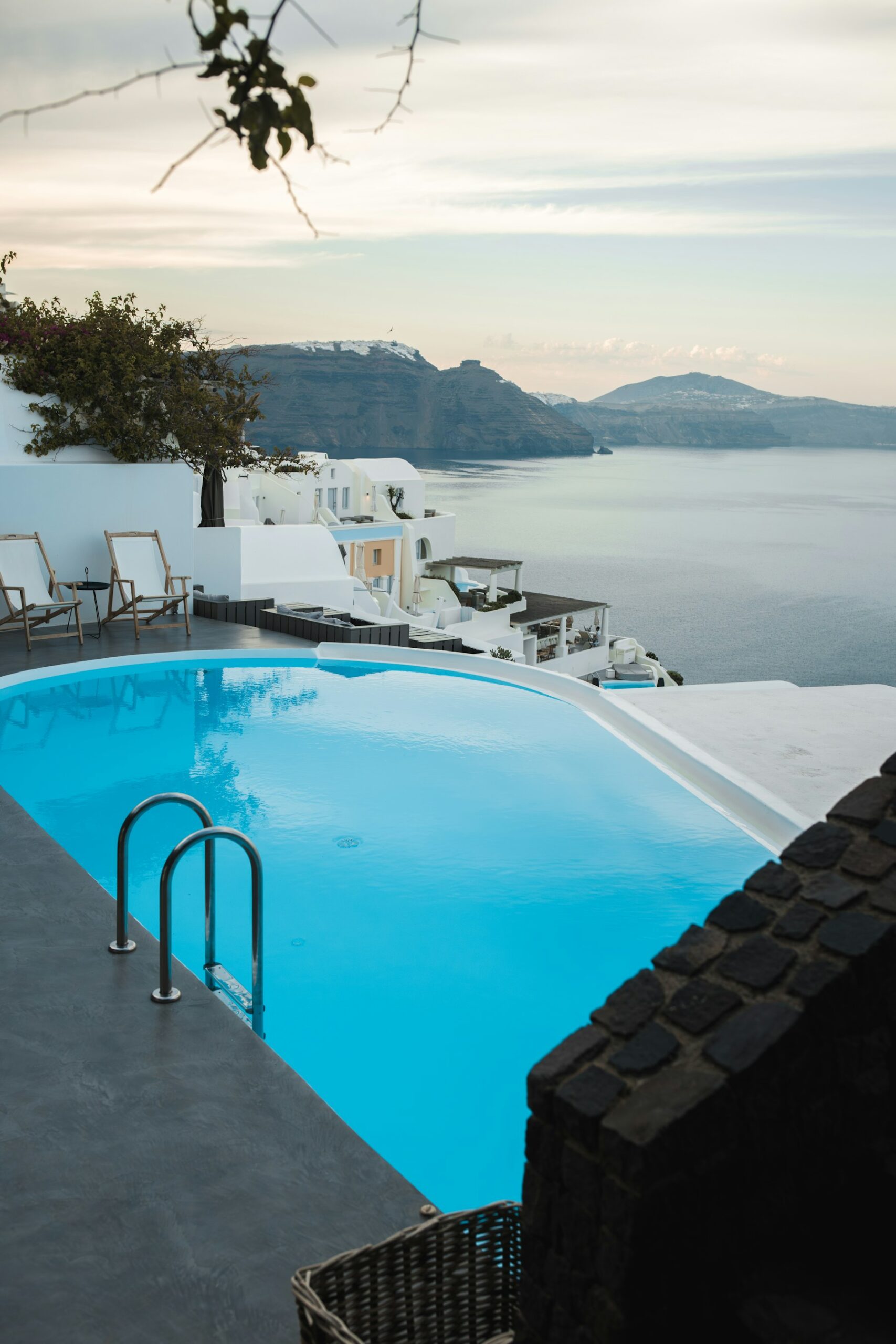Bright coastal architecture and infinity pool overlooking the Santorini caldera